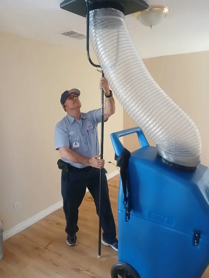 Furnace Tune-Up technician using HEPA equipment in Bel Air South